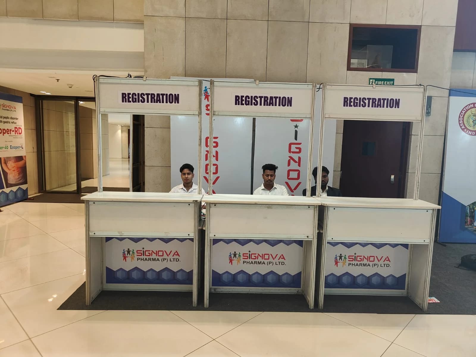Staffed registration counters at the Association of Physicians of India event